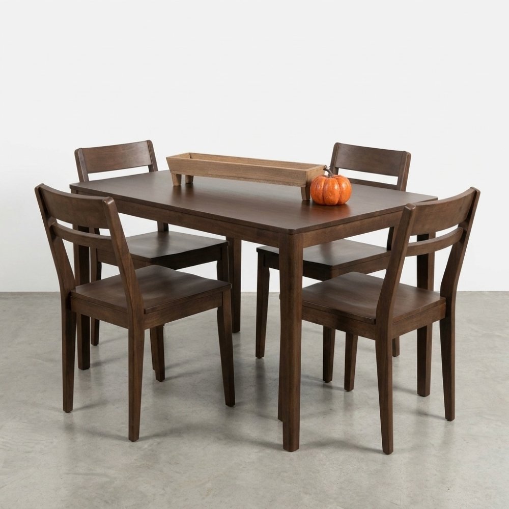 Wooden dining set with a small pumpkin centerpiece.