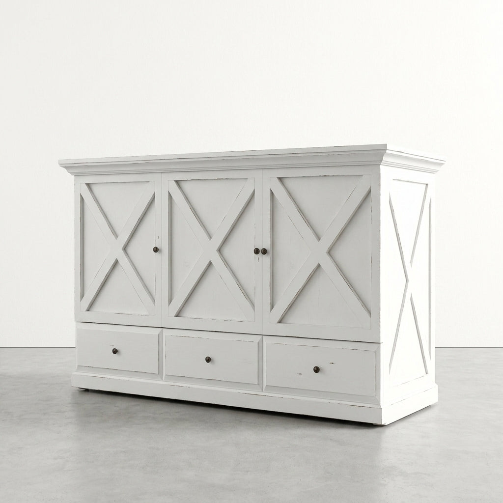 White vintage cabinet with X-panel design and three drawers below.