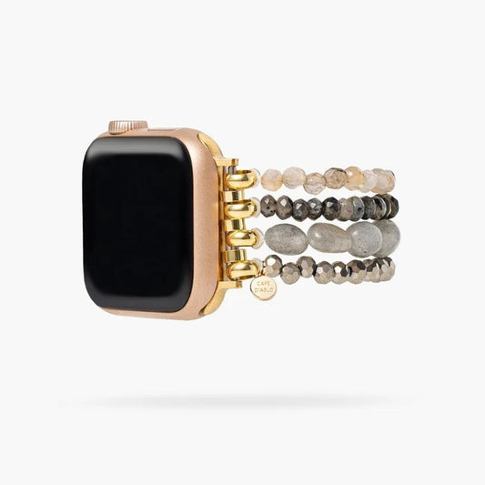 Smartwatch with a beaded, multicolored band and gold accents.