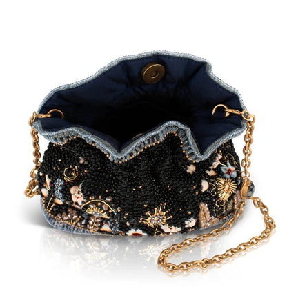 Elegant beaded purse with floral patterns and a gold chain strap.