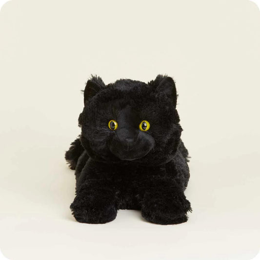 A plush black cat with yellow eyes on a light background.