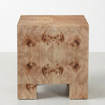Wooden side table with intricate burl pattern design.