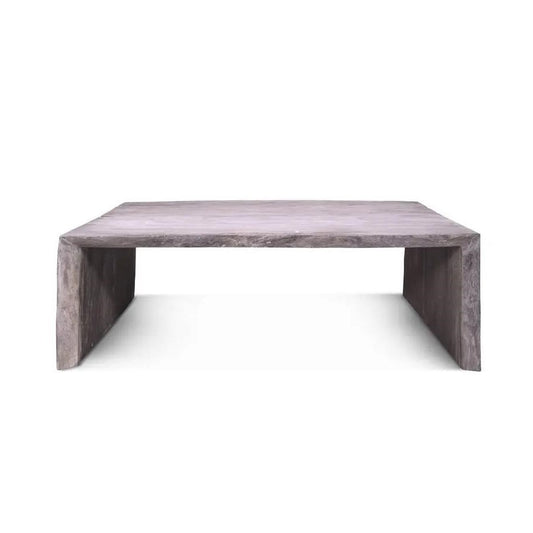 Minimalist concrete coffee table with a simplistic design.