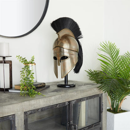 Bronze helmet on a stand, surrounded by plants and books.