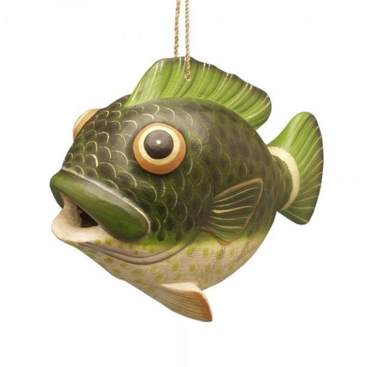 Green fish ornament with large eyes hanging by a string.