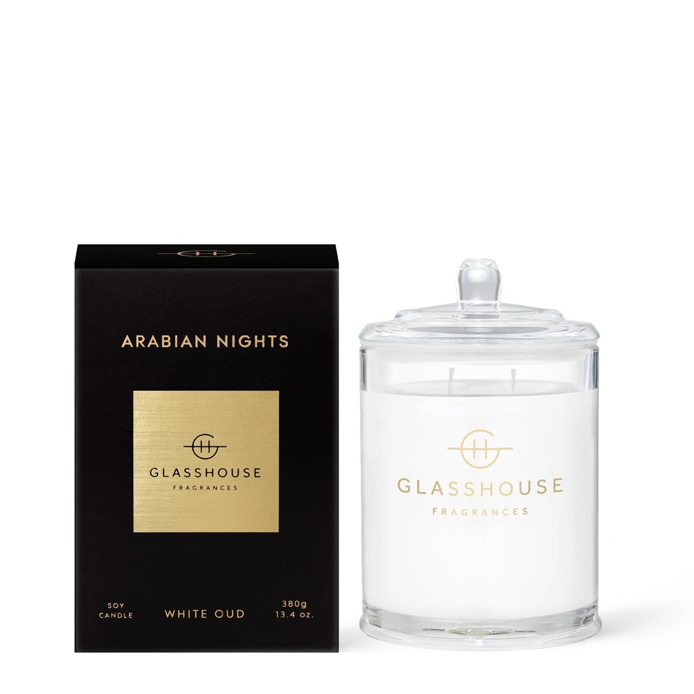 Black box with "Arabian Nights" and white candle with glass lid.