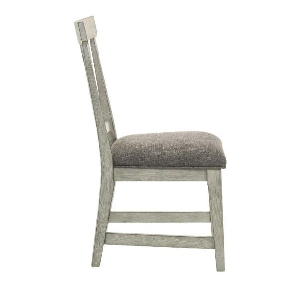 Side view of a wooden chair with a cushioned seat.