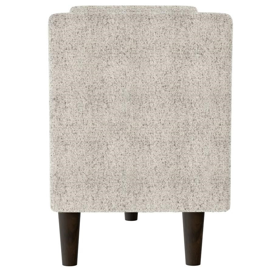 Gray upholstered chair with dark wooden legs, rear view.