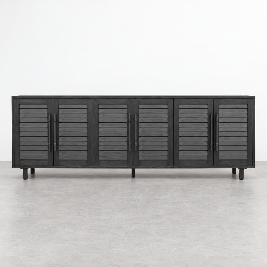 A long dark wood sideboard with six louvered doors stands against a plain white wall.