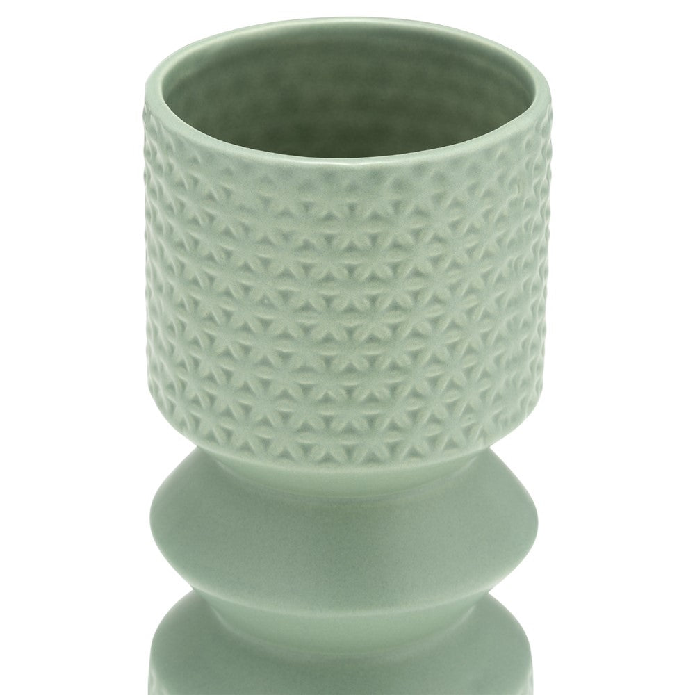 Mint-green cylindrical vase with textured patterns.