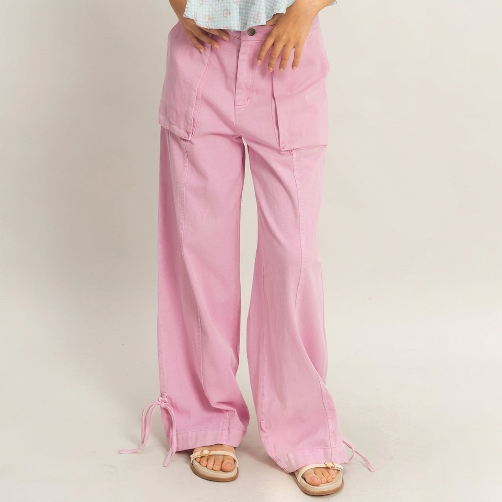 Model in pink wide-leg pants and sandals.