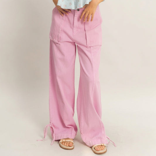 Model in pink wide-leg pants and sandals.