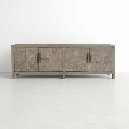 Rustic brown wooden sideboard with geometric patterns and black handles.