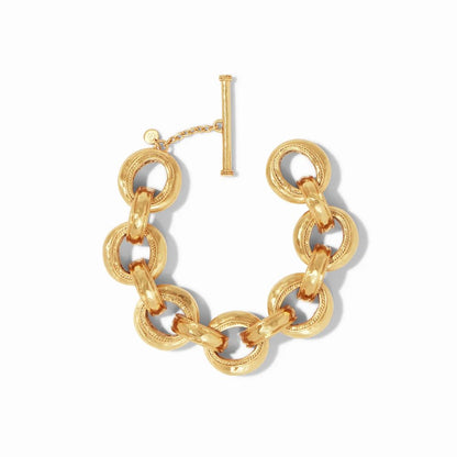 A chunky gold chain bracelet with interlocking links and a toggle clasp.