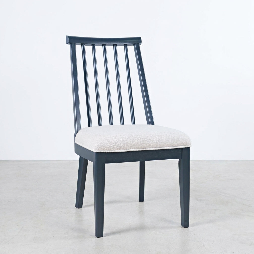Modern wooden chair with a cushioned seat.