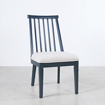 Modern wooden chair with a cushioned seat.