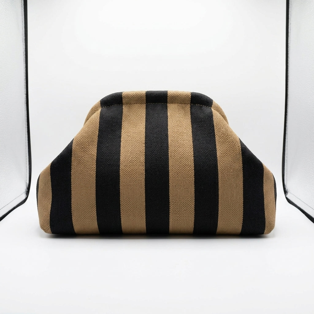 Striped brown and black fabric-covered object in a white setting.