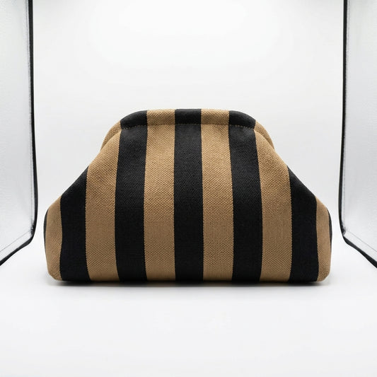 Striped brown and black fabric-covered object in a white setting.