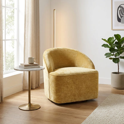 Comfy, golden velvet armchair with a rounded backrest.