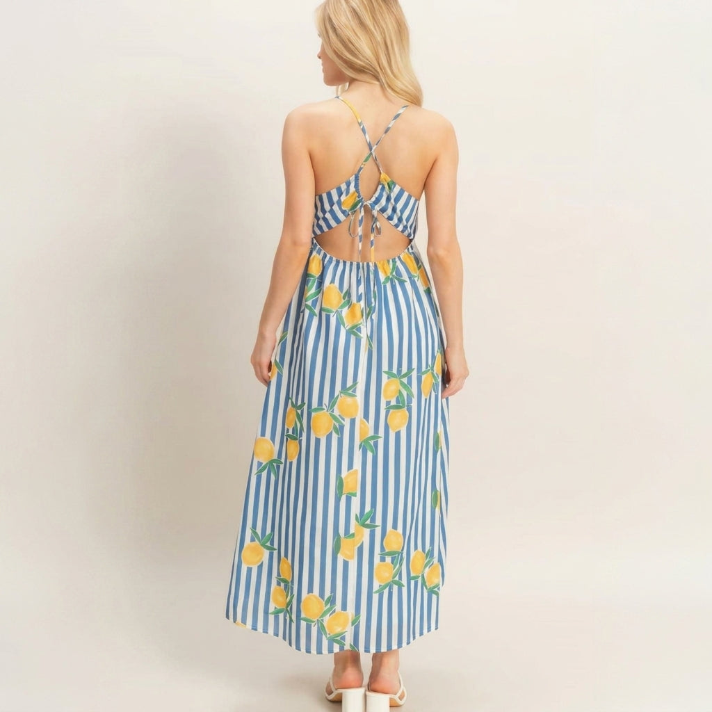 Back view of a woman in a blue striped dress with lemon patterns.