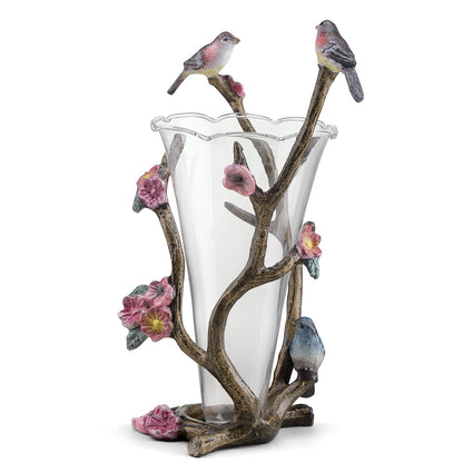 Glass vase with floral and bird branch design.