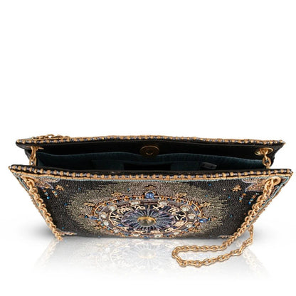 Elegant beaded clutch with a gold chain and intricate, colorful design.