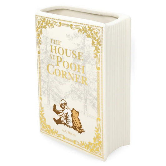 Ceramic jar shaped like "The House at Pooh Corner" book.