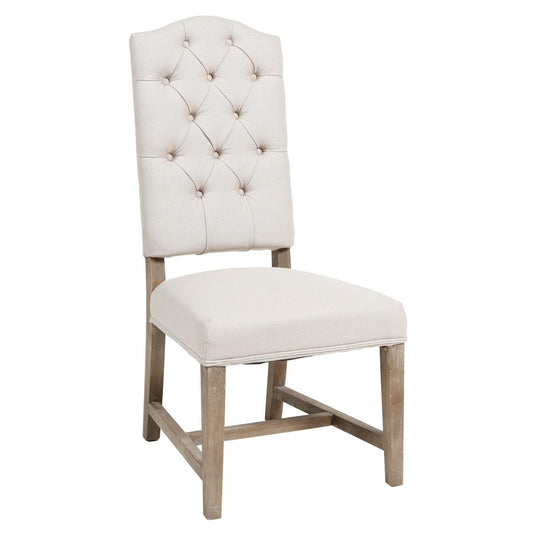 Cream tufted chair with wooden legs.
