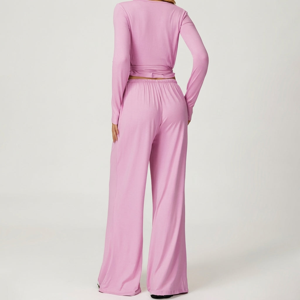 Person in pink lounge set, showing back view.