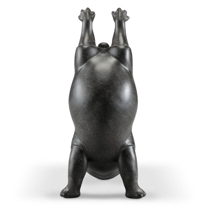 Abstract sculpture of a bear standing on its hind legs.