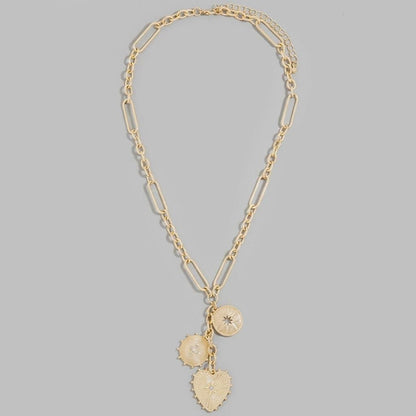 Gold chain necklace with three decorative charms.