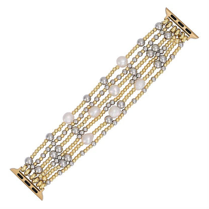 Gold and silver beaded bracelet with pearl accents.