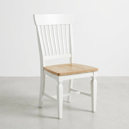 White wooden chair with a light wood seat.