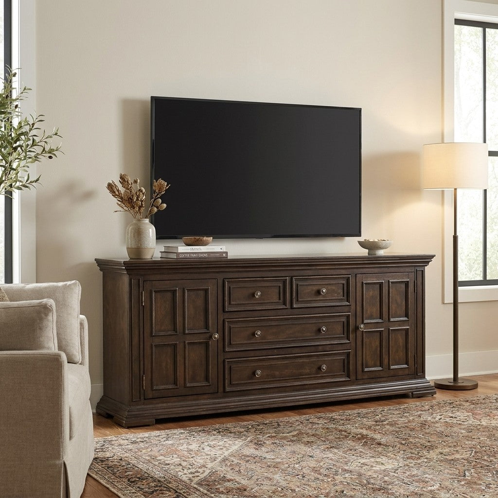 Living room with TV, wooden console, sofa, and lamp.