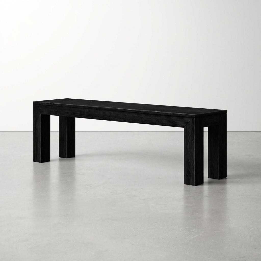 Minimalist black bench in a simple, white space.