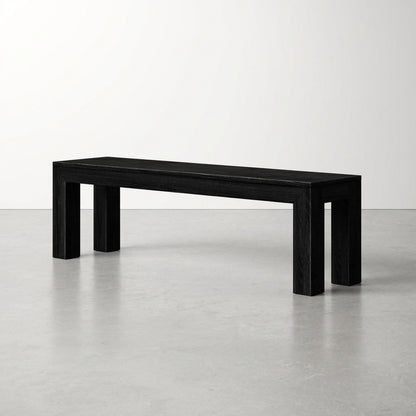 Minimalist black bench in a simple, white space.