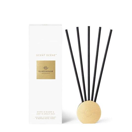 Glasshouse diffuser set with black sticks and a golden base.