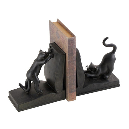 Cat-themed bookends holding a book upright.