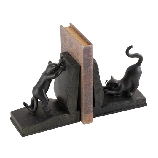 Cat-themed bookends holding a book upright.