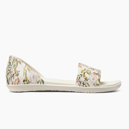 Floral-print sandal with open toe and back, featuring a flat sole.