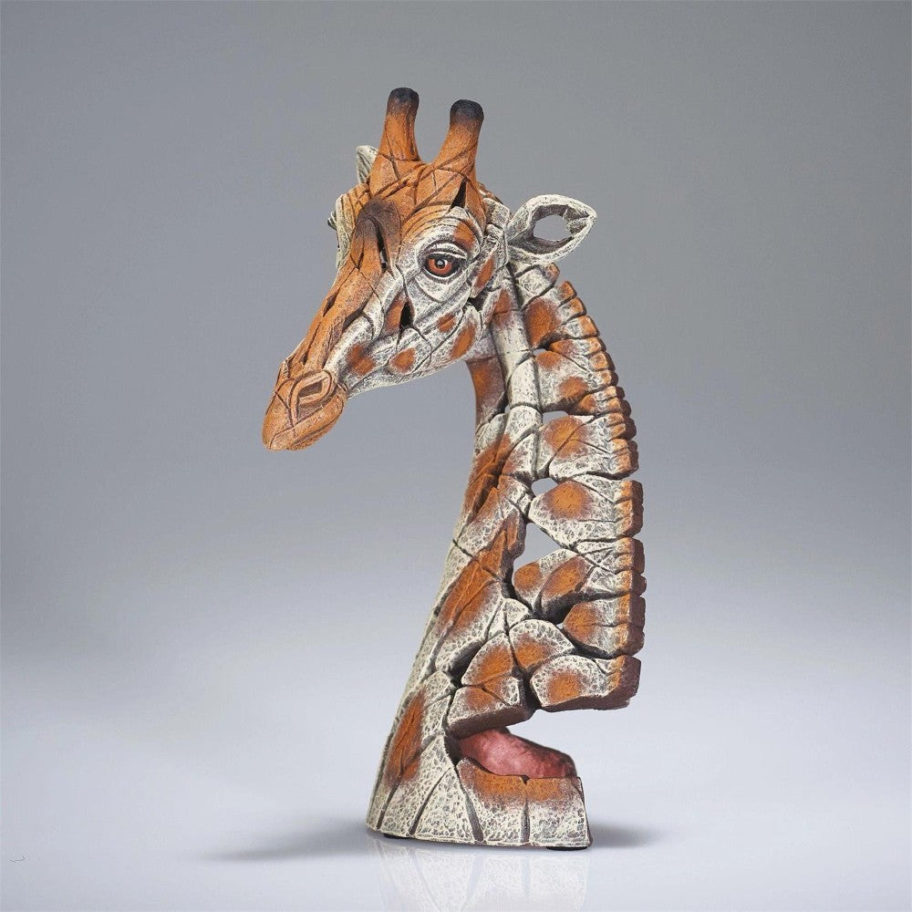 Abstract giraffe sculpture with geometric patterns.