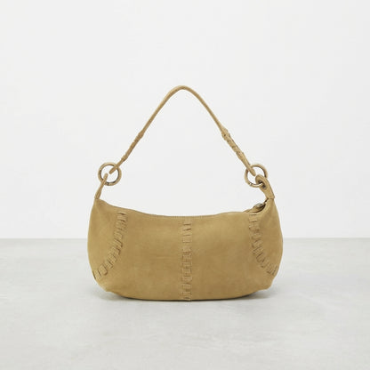 Small tan handbag with loop handle and decorative stitching.