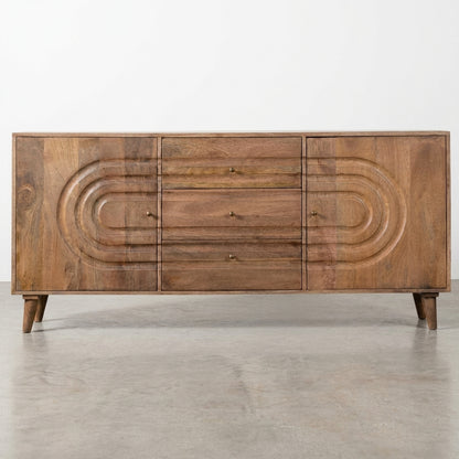 Wooden sideboard with circular patterns and three drawers.