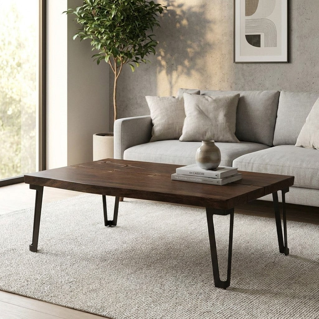Dark wood table with metal legs and minimalist design.