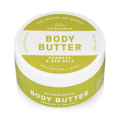 Green and white jar of seaweed and sea salt body butter.