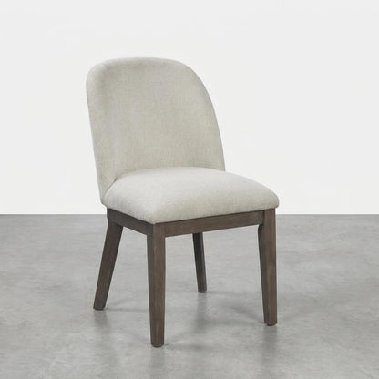 Modern upholstered chair with wooden legs.