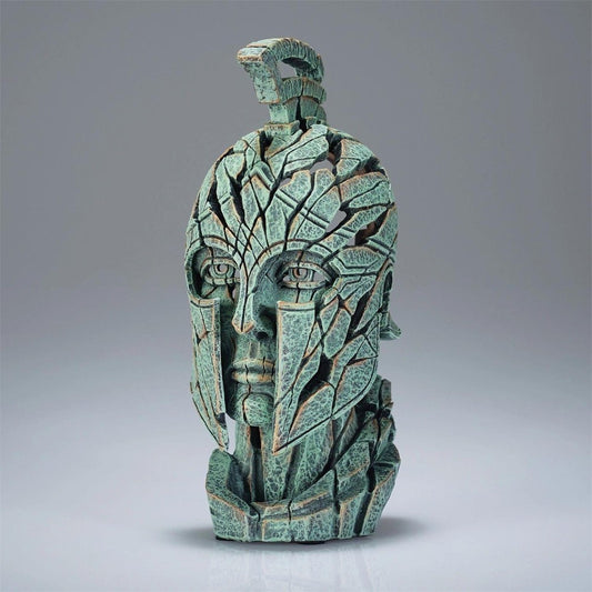 Cracked warrior helmet sculpture in shades of green.