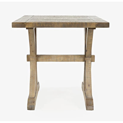 Rustic wooden table with sturdy legs and a flat top.