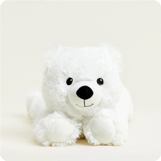 Fluffy white polar bear plush toy with a cute face.