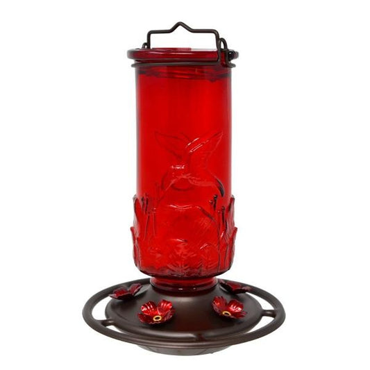 Red hummingbird feeder with floral details.